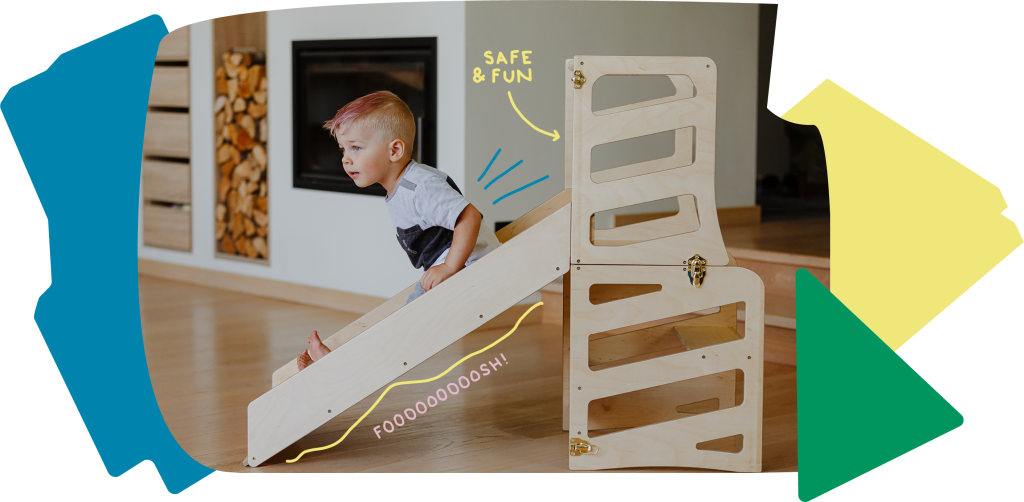 Kid sliding down the Montessori learning tower